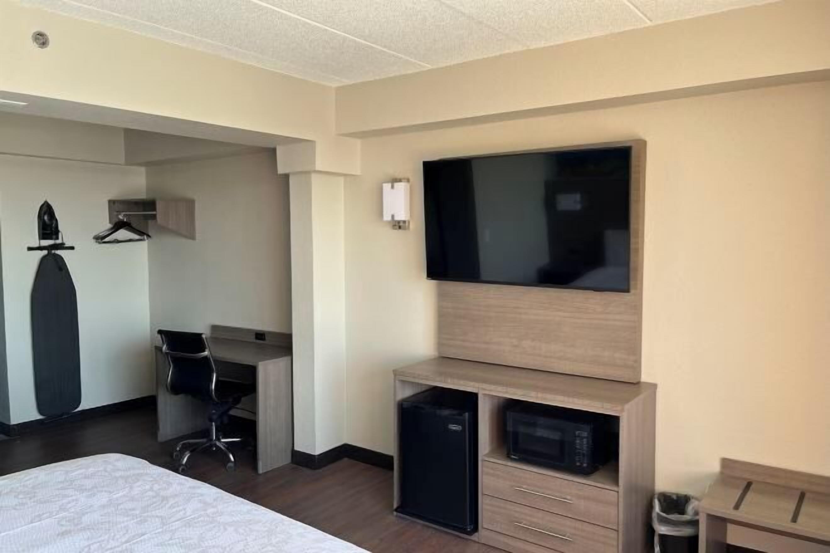 Desk, laptop workspace, blackout curtains, iron/ironing board