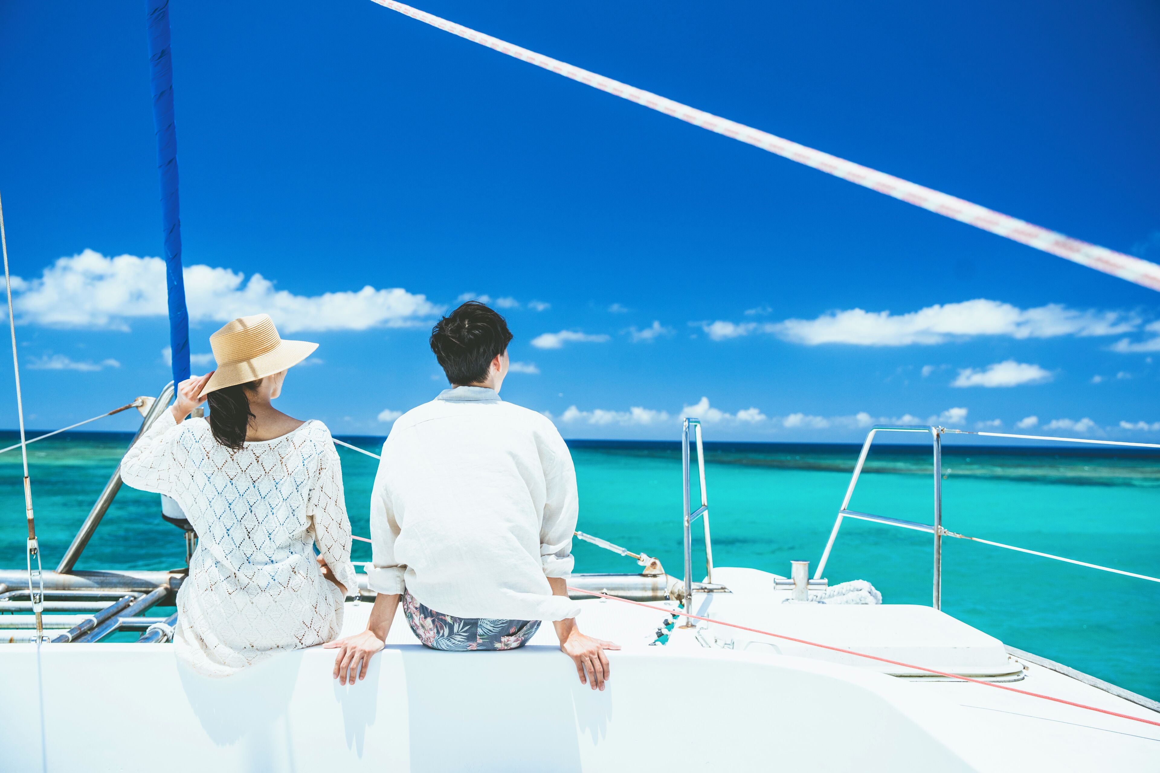 on the beach, white sand, beach umbrellas, beach towels