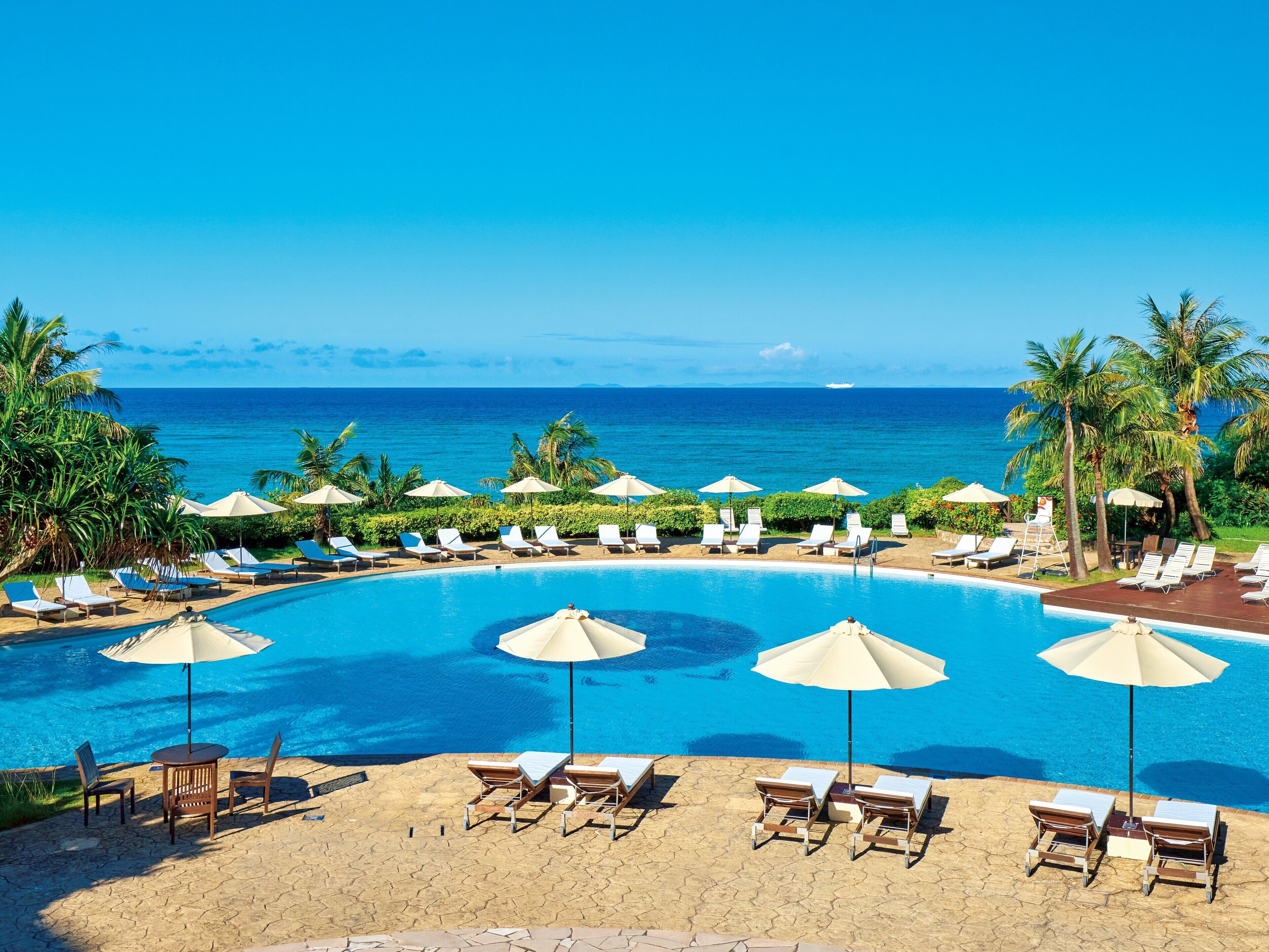 indoor pool, seasonal outdoor pool, pool umbrellas