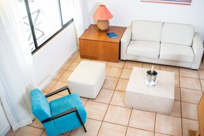 Royal Suite, 1 King Bed & 2 Queen beds | Living area | 32-inch LCD TV with cable channels, TV
