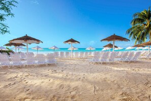 On the beach, white sand, sun loungers, beach umbrellas - Bougainvillea Barbados (Maxwell)
