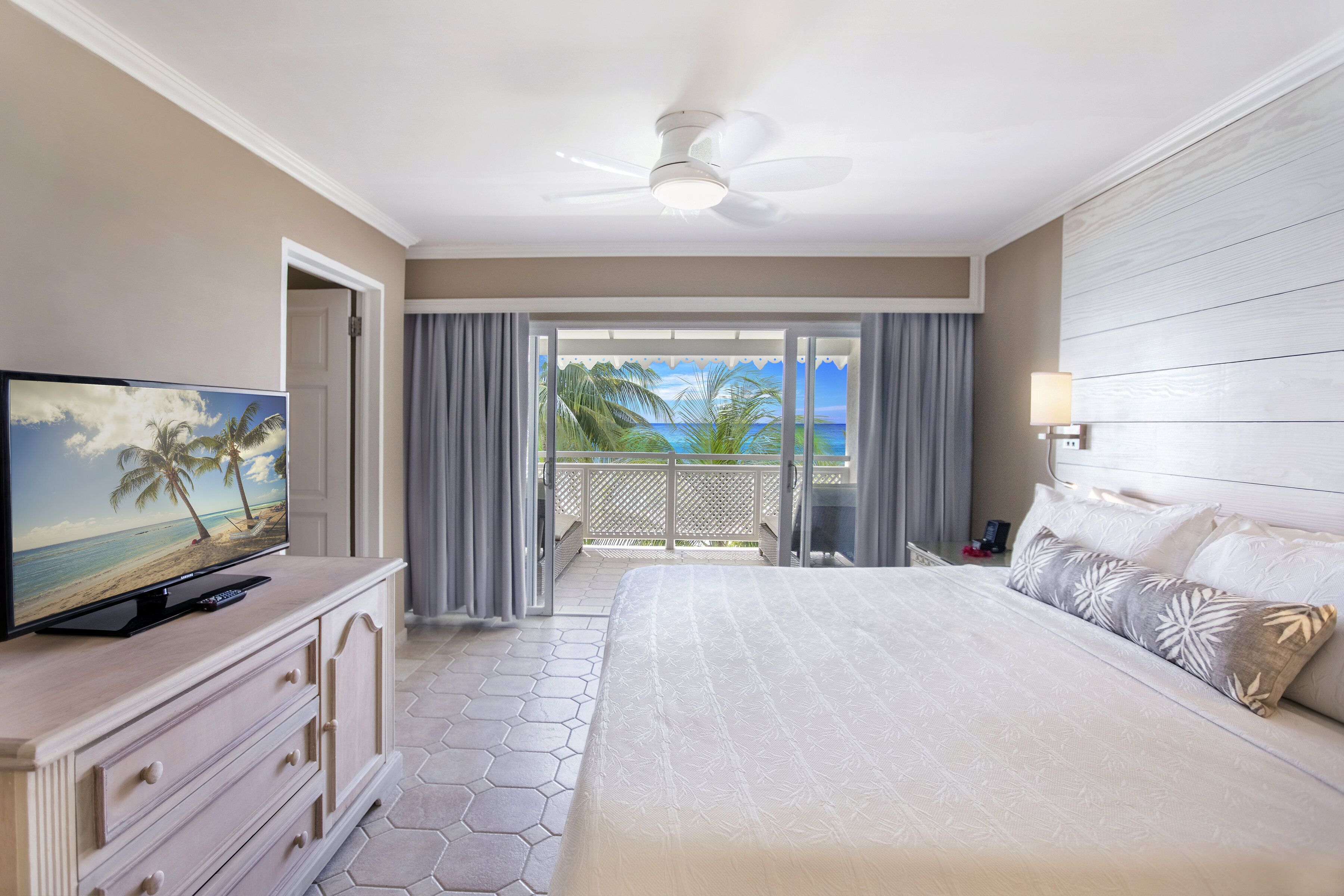 deluxe suite, 2 bedrooms, balcony, partial ocean view | in-room safe, desk, blackout curtains, iron/ironing board