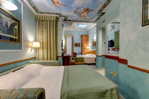 Family Quadruple Room | Minibar, in-room safe, desk, free WiFi