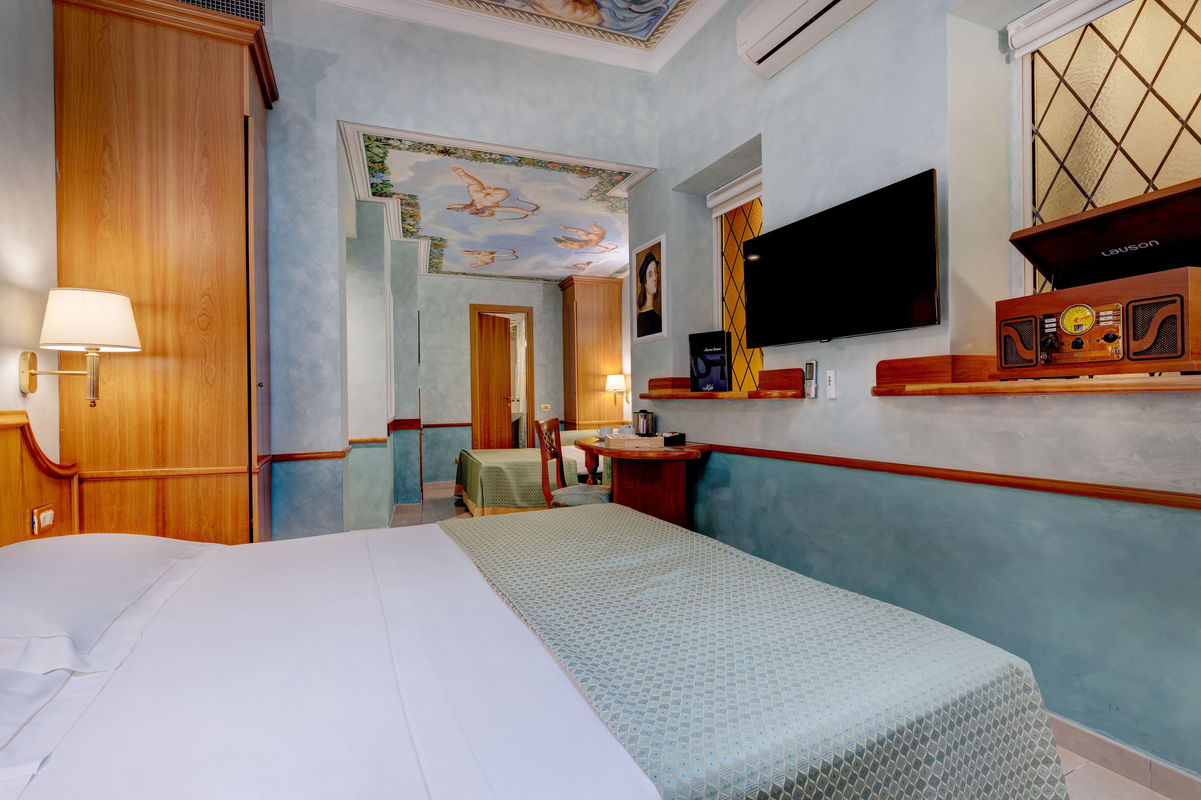 family quadruple room | 1 bedroom, minibar, in-room safe, desk