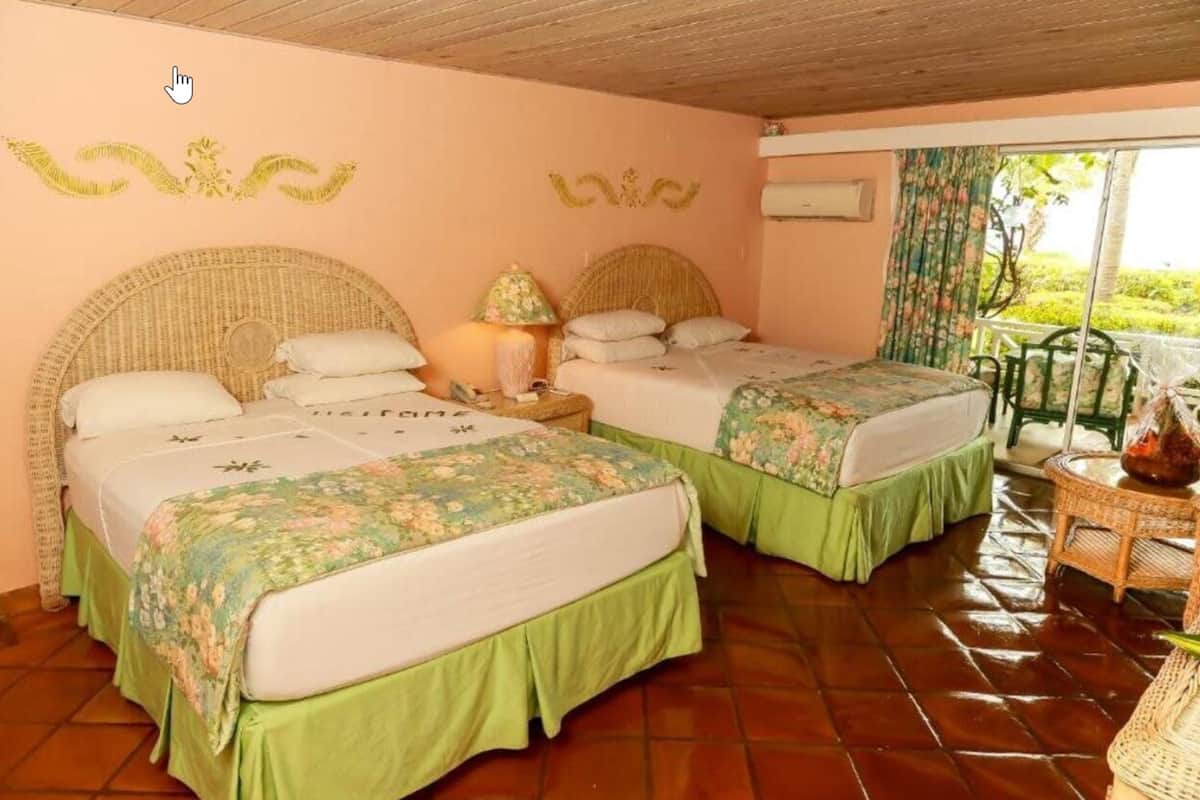 Superior Room, Garden View | Minibar, in-room safe, iron/ironing board, free cribs/infant beds