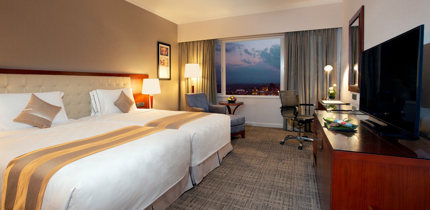 deluxe twin room | minibar, in-room safe, individually furnished, desk