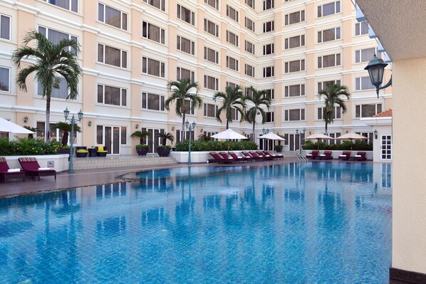 Outdoor pool, open 6:00 AM to 10:00 PM, pool umbrellas, pool loungers