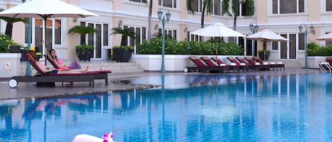 Outdoor pool, open 6:00 AM to 10:00 PM, pool umbrellas, sun loungers