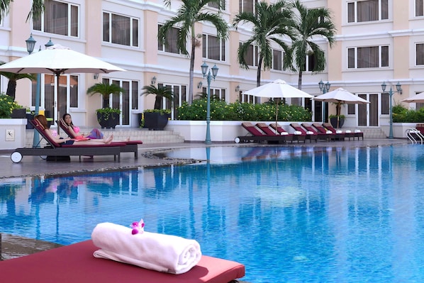 Outdoor pool, open 6:00 AM to 10:00 PM, pool umbrellas, pool loungers