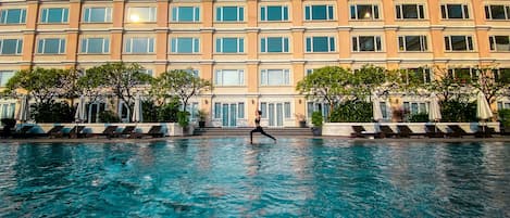 Outdoor pool, open 6:00 AM to 10:00 PM, pool umbrellas, sun loungers