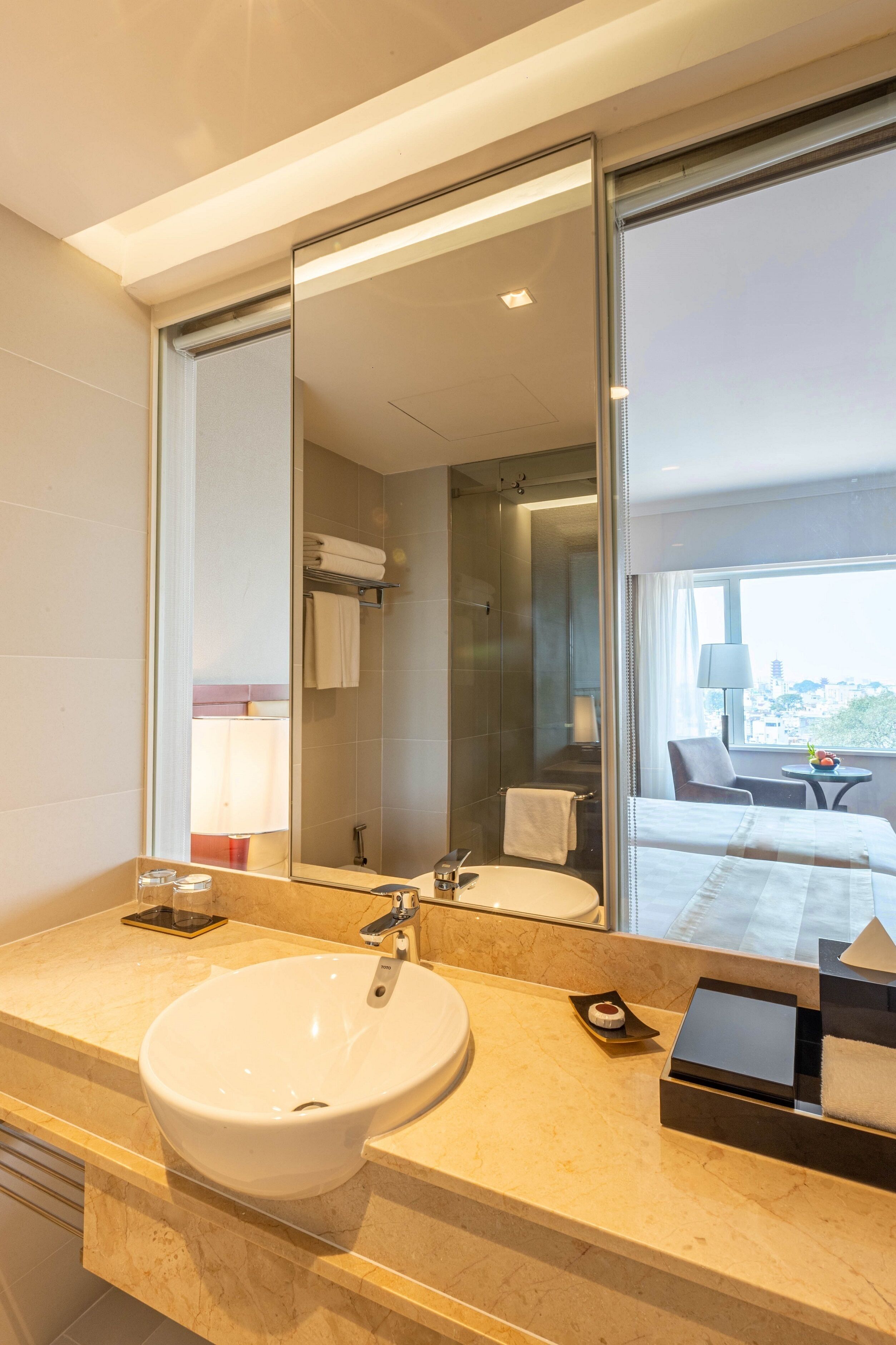 deluxe room, 1 king bed | bathroom | eco-friendly toiletries, hair dryer, bathrobes, slippers