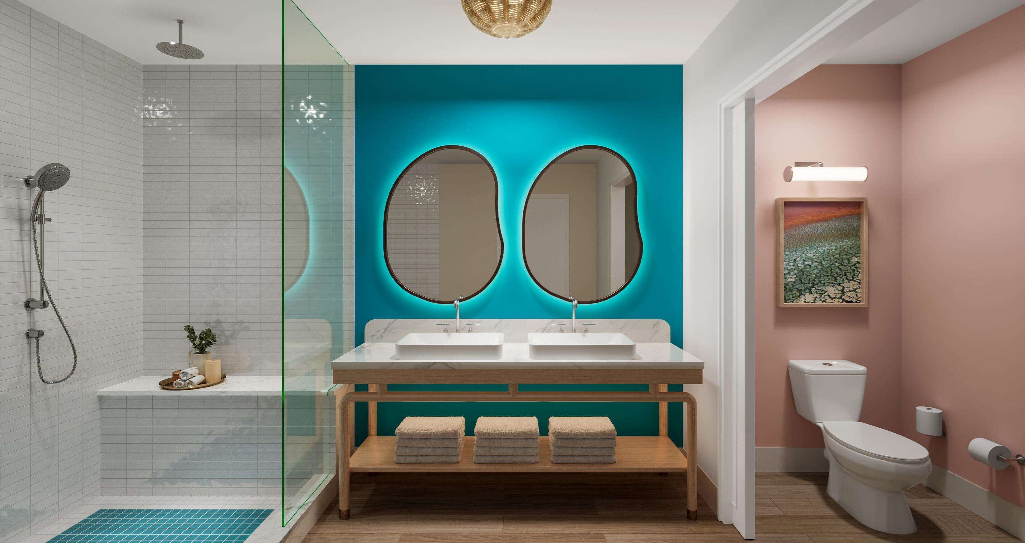 Un bagno moderno con cabina doccia in vetro, lavabo doppio e servizi igienici.