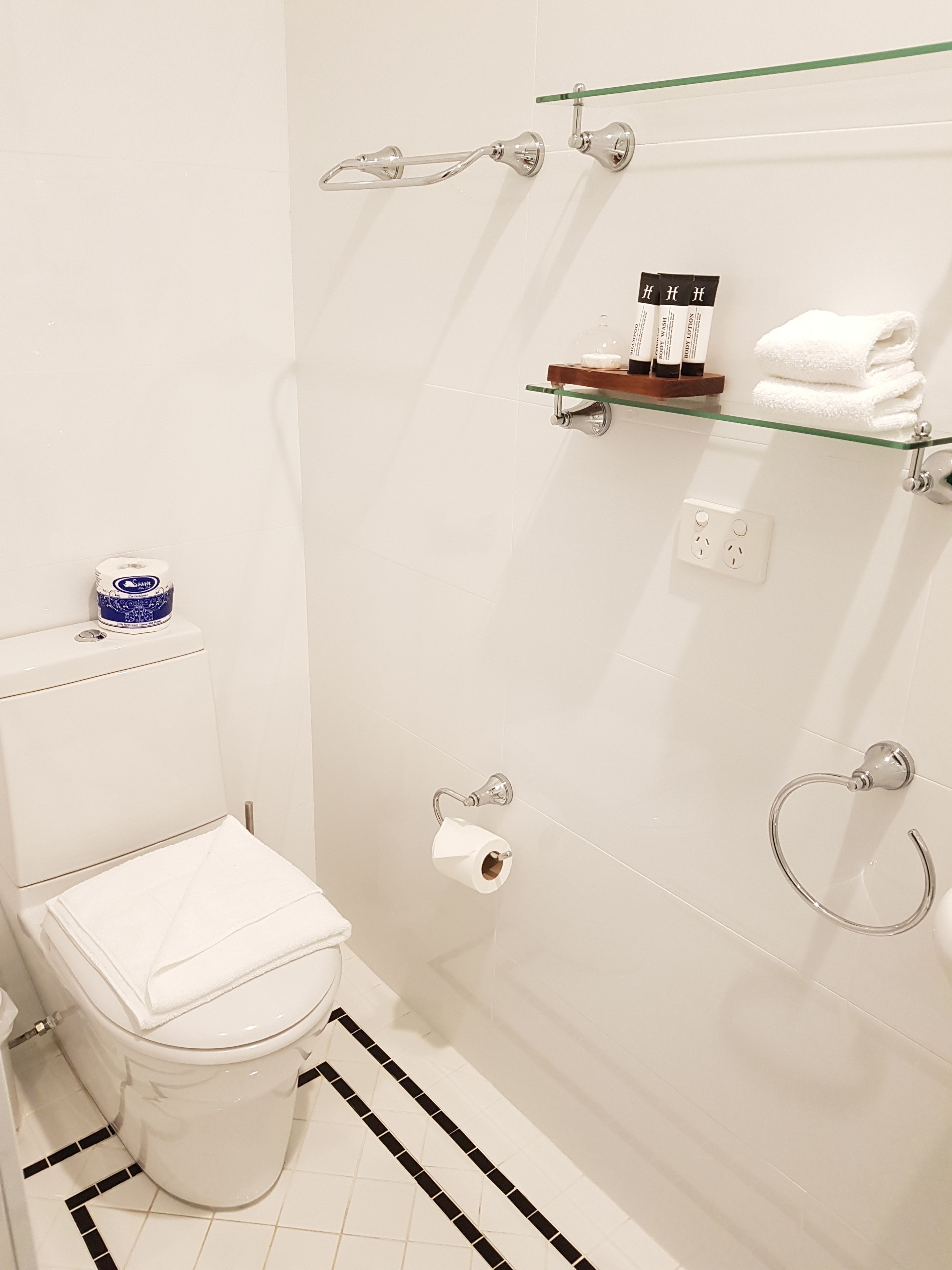 shower, designer toiletries, hair dryer, towels