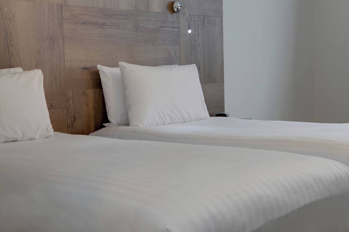 standard room, 2 single beds, non smoking | in-room safe, desk, laptop workspace, blackout curtains