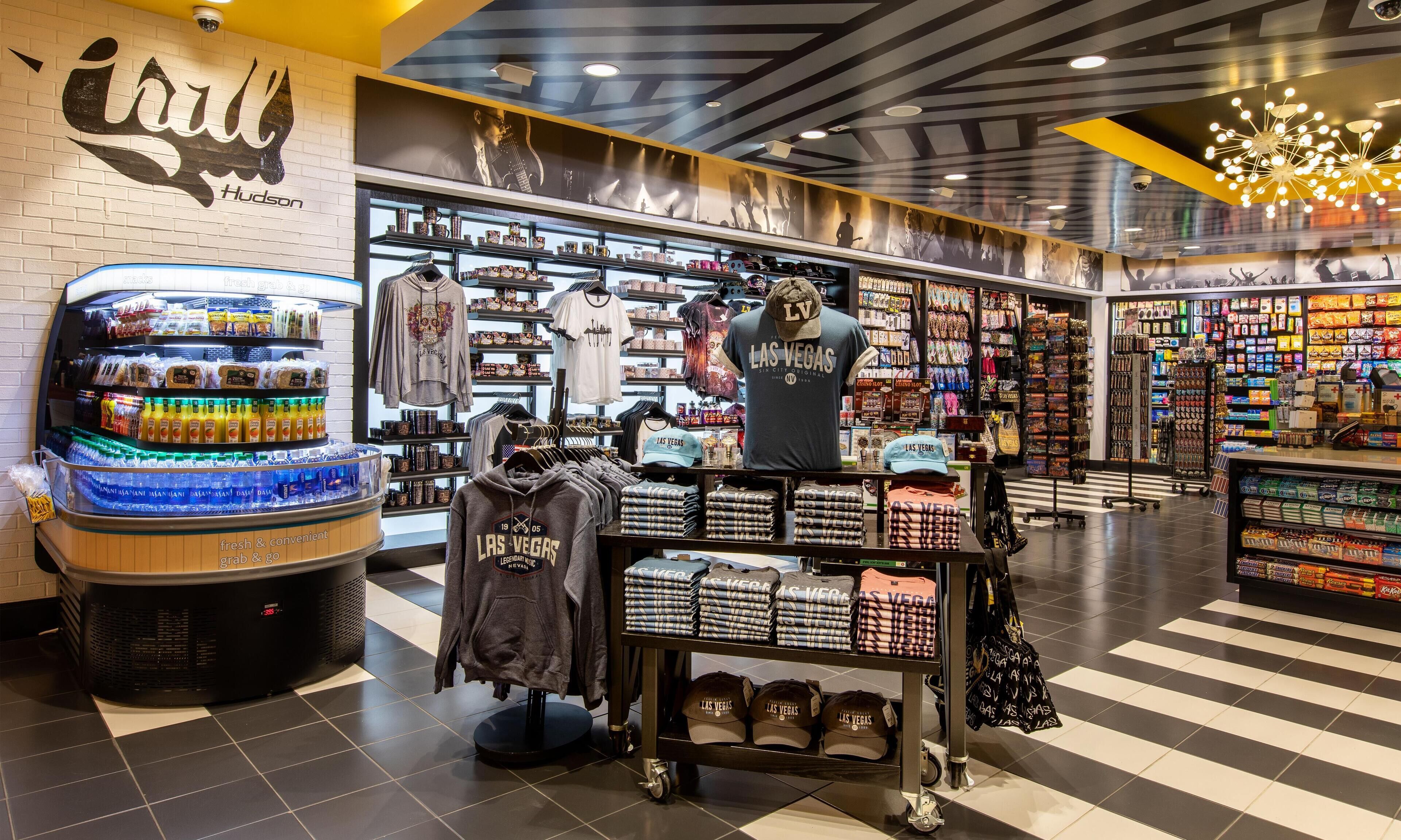 A retail store with a variety of merchandise including clothing, accessories, and beverages.