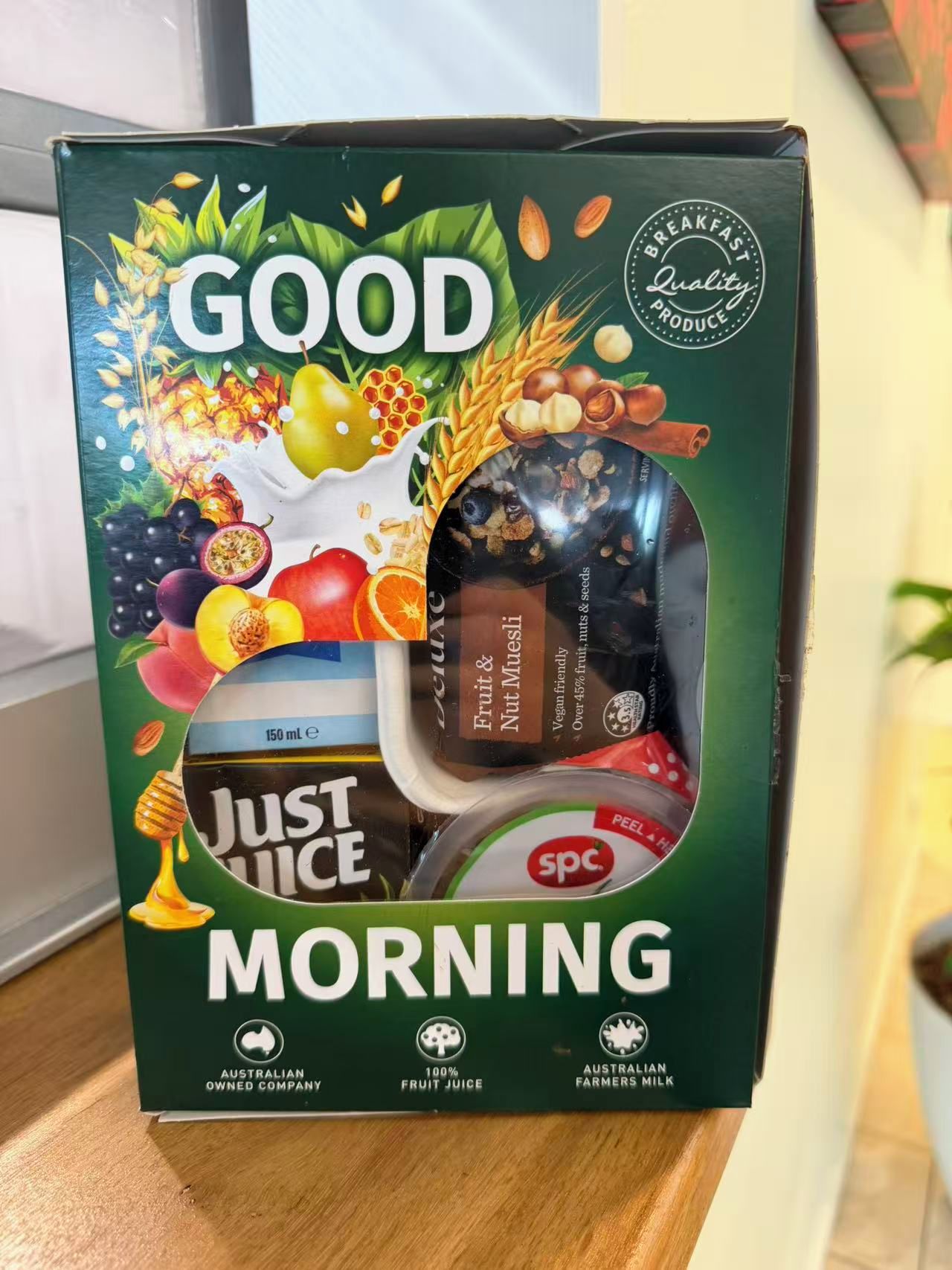 A box of Good Morning brand breakfast cereal with a variety of fruits and nuts.