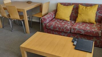 1 Bedroom Deluxe Apartment | Living area | TV, DVD player