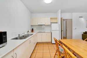 2 Bedroom Apartment | Private kitchen | Microwave, coffee/tea maker, electric kettle, cookware/dishes/utensils