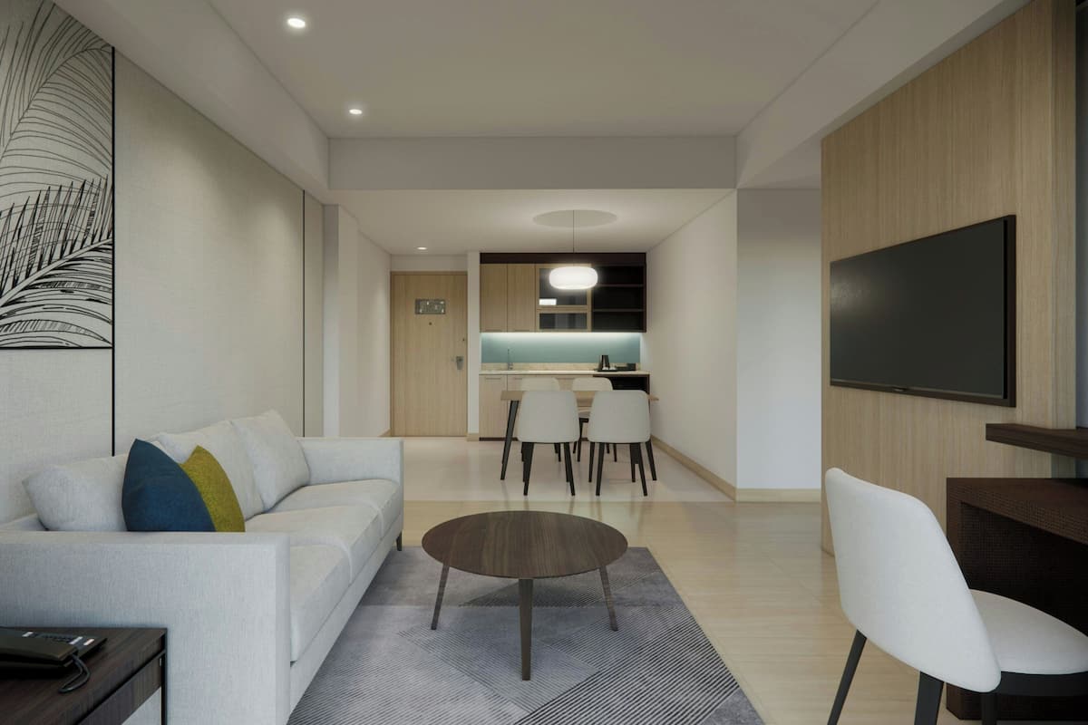 Suite, 1 King Bed, Garden View | Living room | 29-inch LCD TV with satellite channels, TV, fireplace