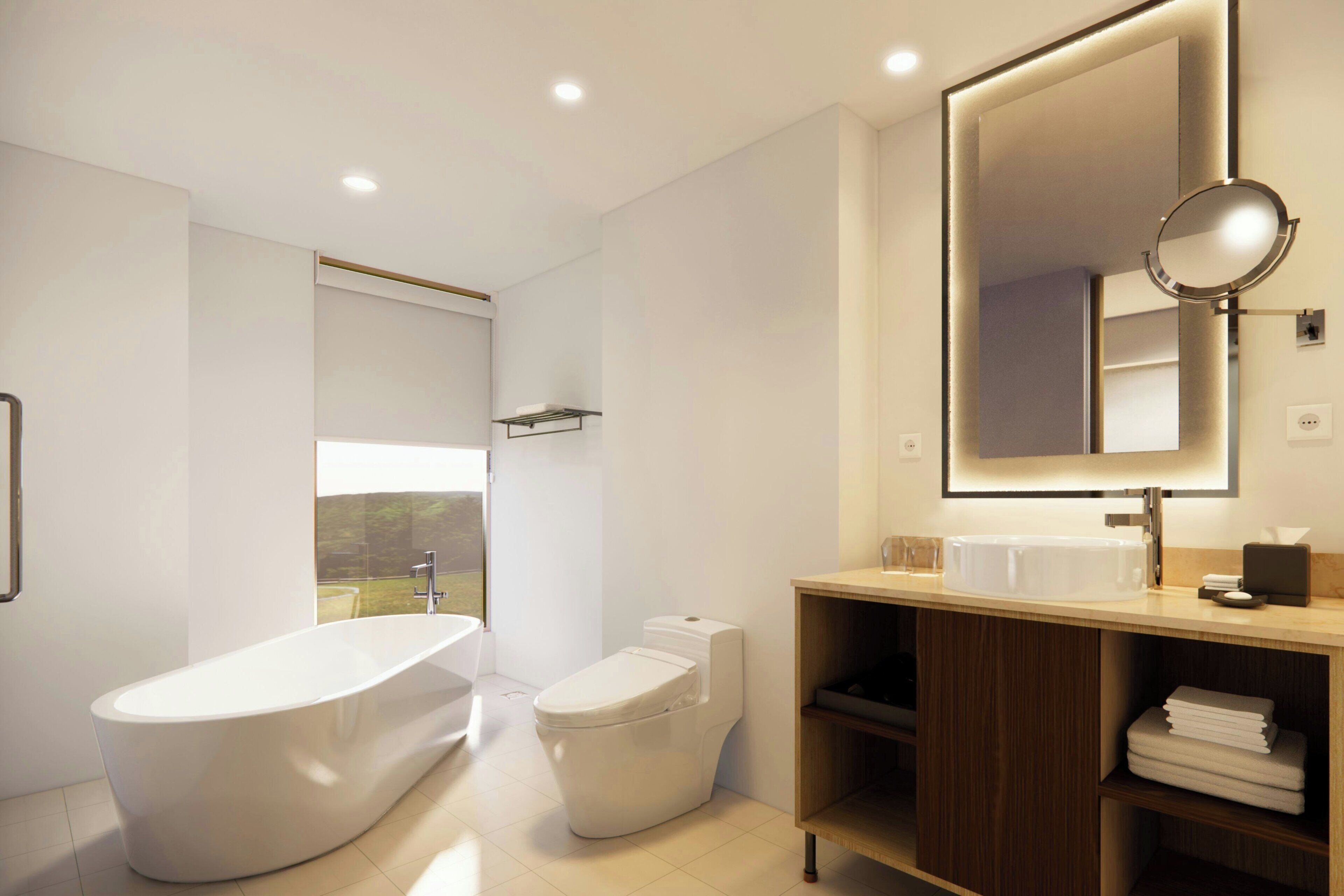 A modern bathroom with a freestanding bathtub, a toilet, and a vanity with a mirror.