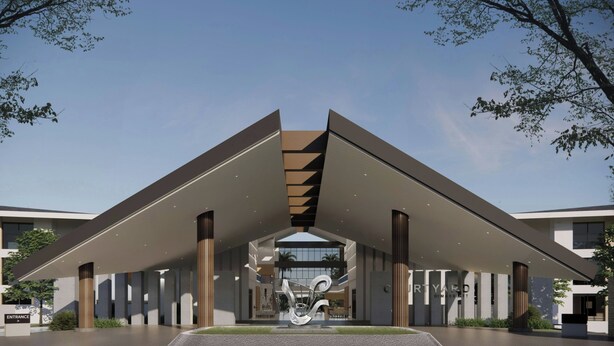 A modern building with a central atrium, a staircase, and a large sculpture. - Courtyard by Marriott Manado (Manado)