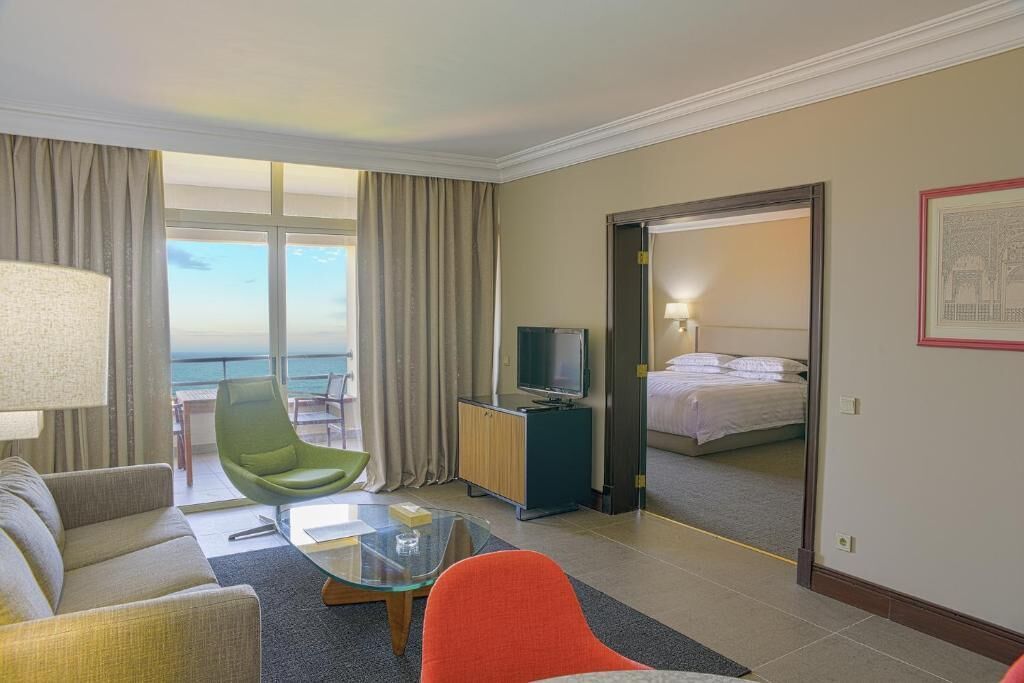 Deluxe Suite, Sea View | Minibar, in-room safe, desk, soundproofing