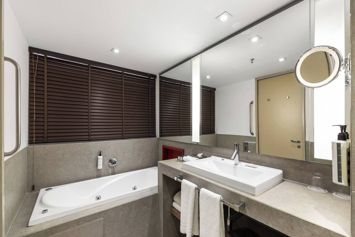 designer toiletries, hair dryer, bathrobes, slippers
