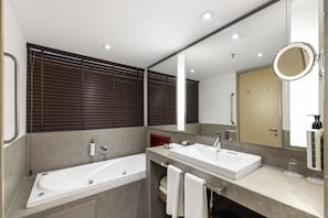 Designer toiletries, hair dryer, bathrobes, slippers