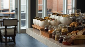 A breakfast buffet with various food items and condiments. - College Park Marriott Hotel & Conference Center (College Park)