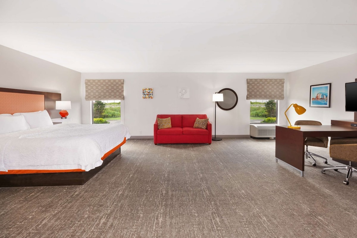 Premium bedding, desk, laptop workspace, blackout curtains