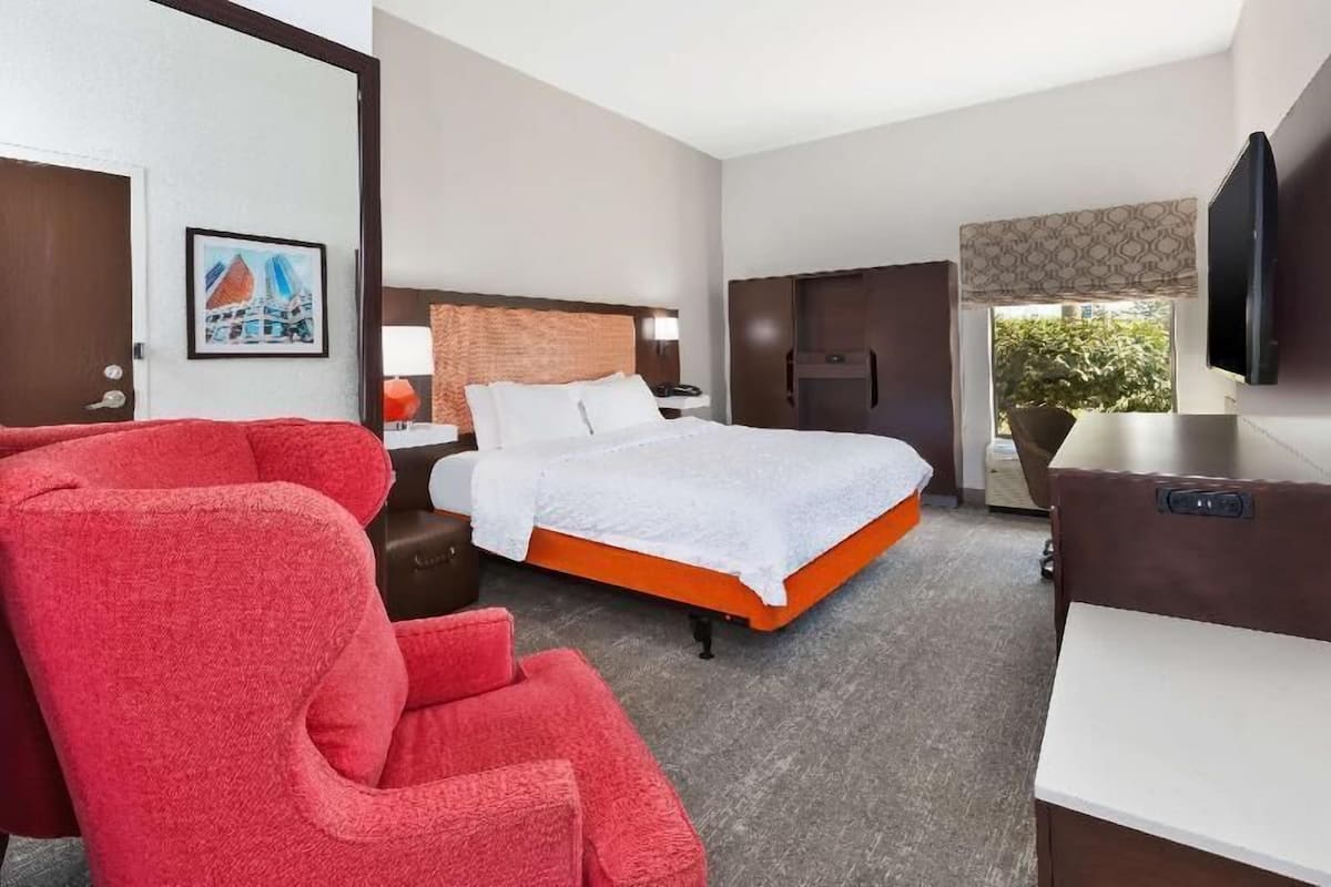 Premium bedding, desk, laptop workspace, blackout curtains