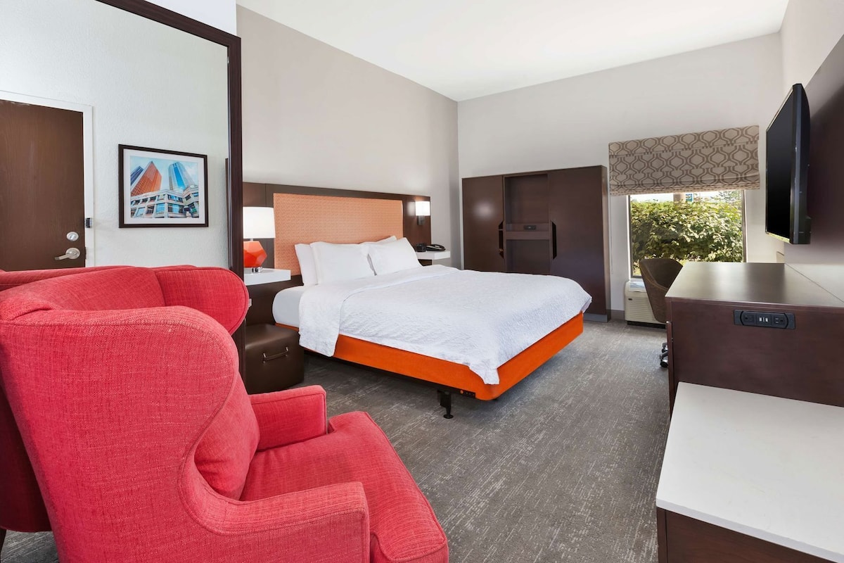 Premium bedding, desk, laptop workspace, blackout curtains