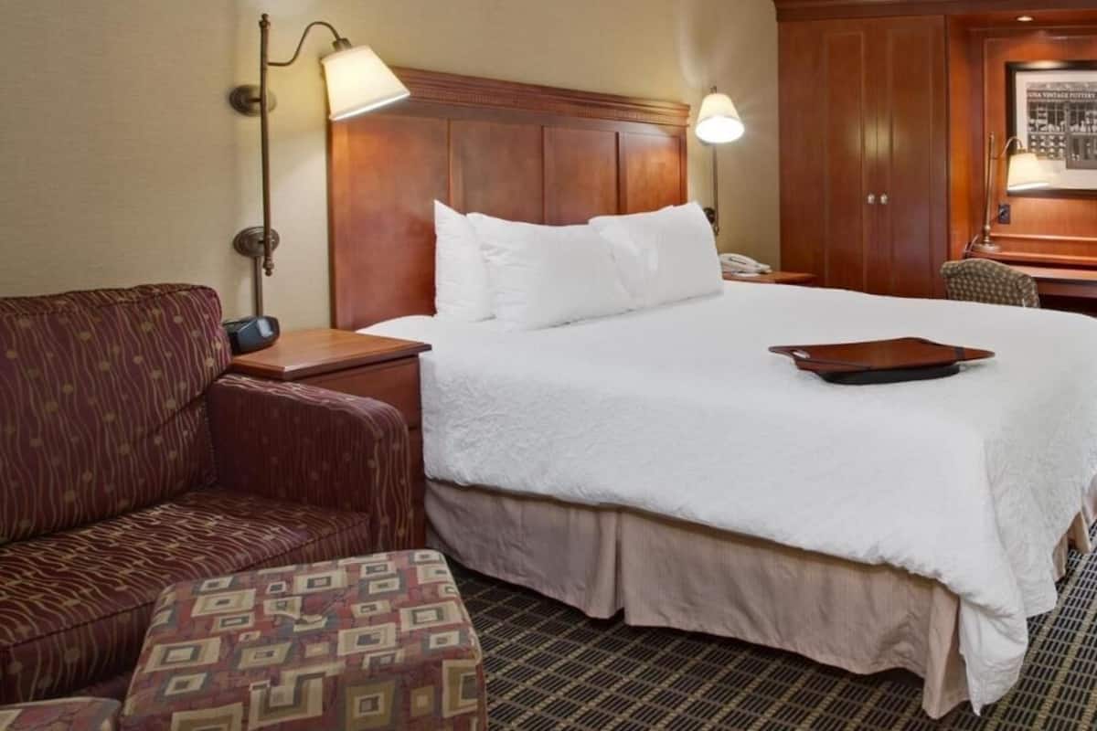 Premium bedding, desk, laptop workspace, blackout curtains