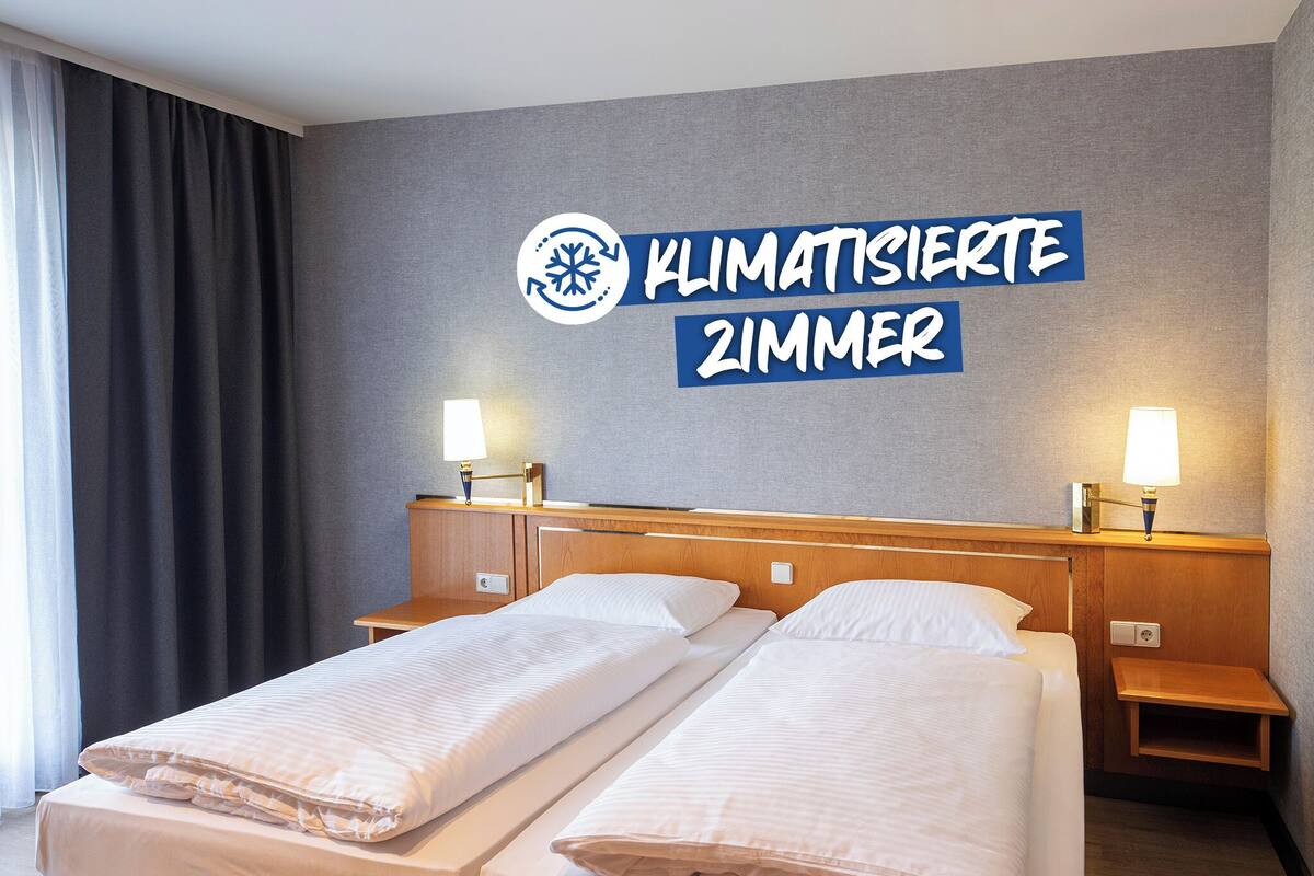 Economy Twin Room | Desk, laptop workspace, blackout drapes, iron/ironing board (on request)