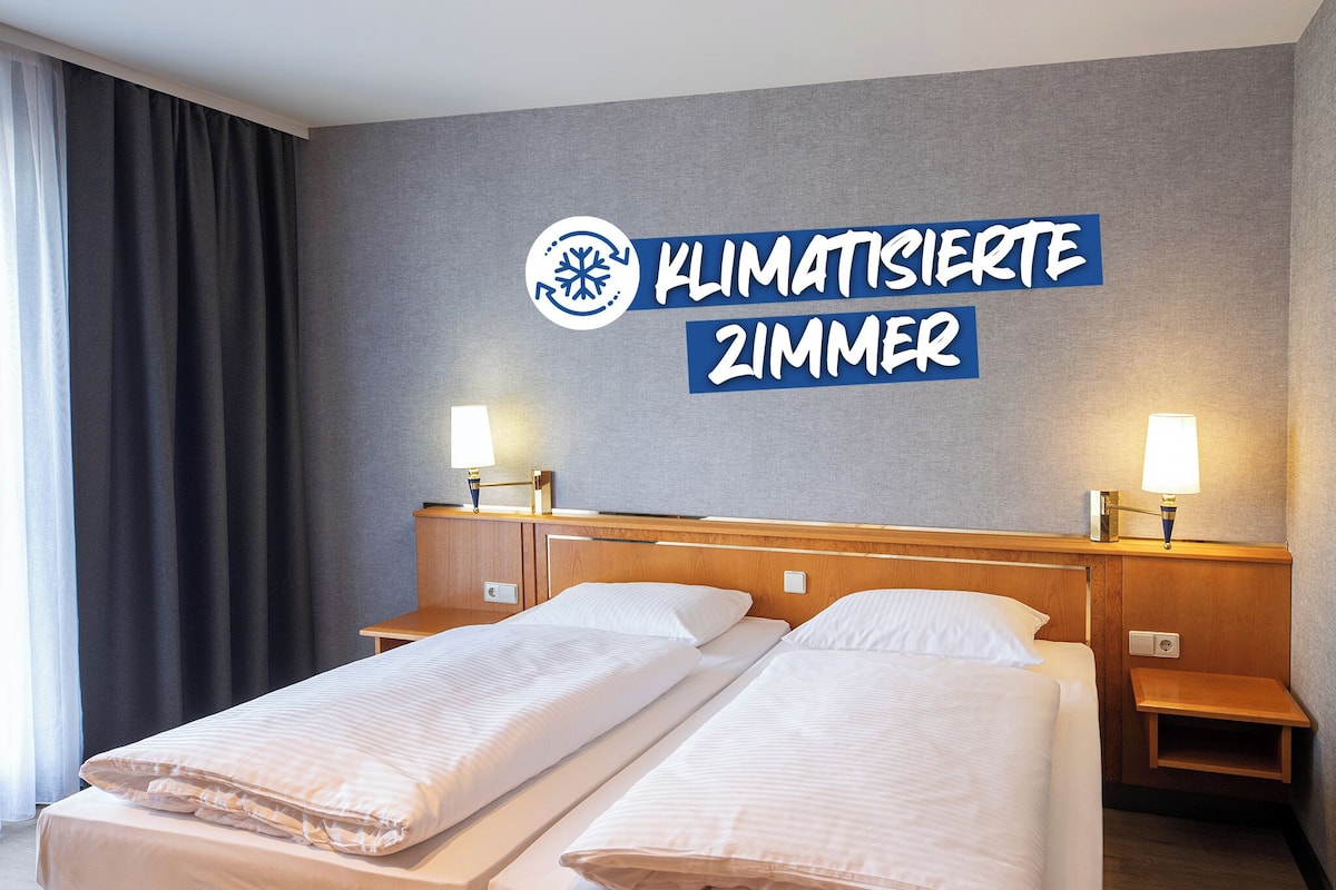 Economy Twin Room | Desk, laptop workspace, blackout drapes, iron/ironing board (on request)