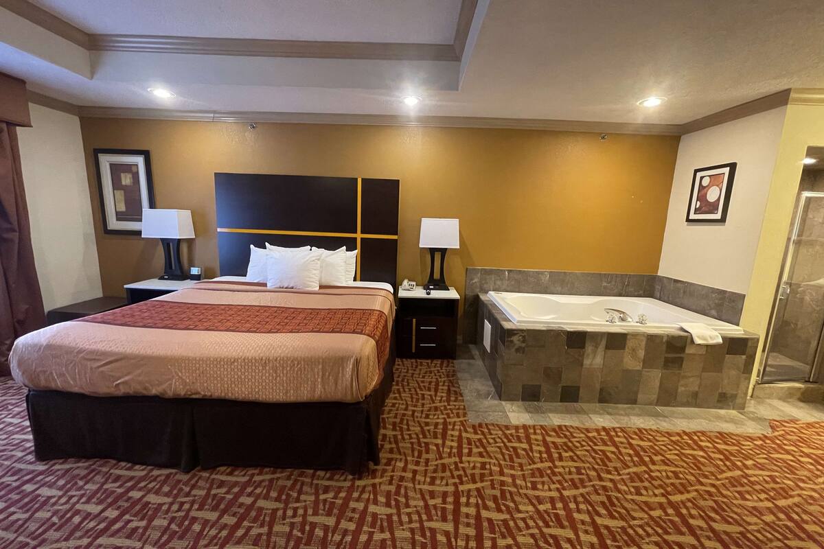 pillow-top beds, desk, laptop workspace, blackout curtains