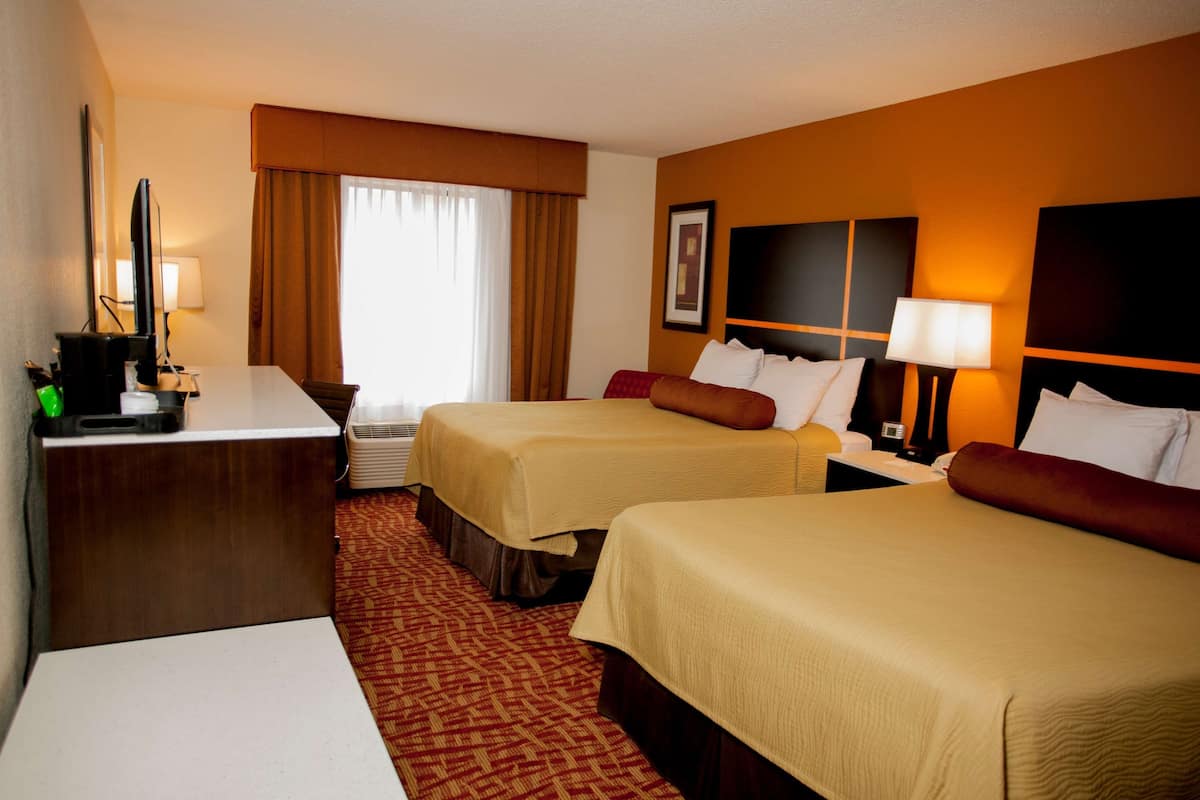 pillow-top beds, desk, laptop workspace, blackout curtains