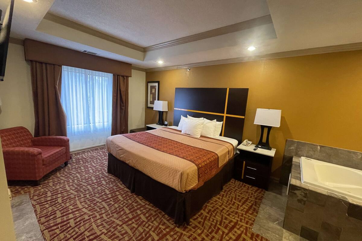 pillow-top beds, desk, laptop workspace, blackout curtains