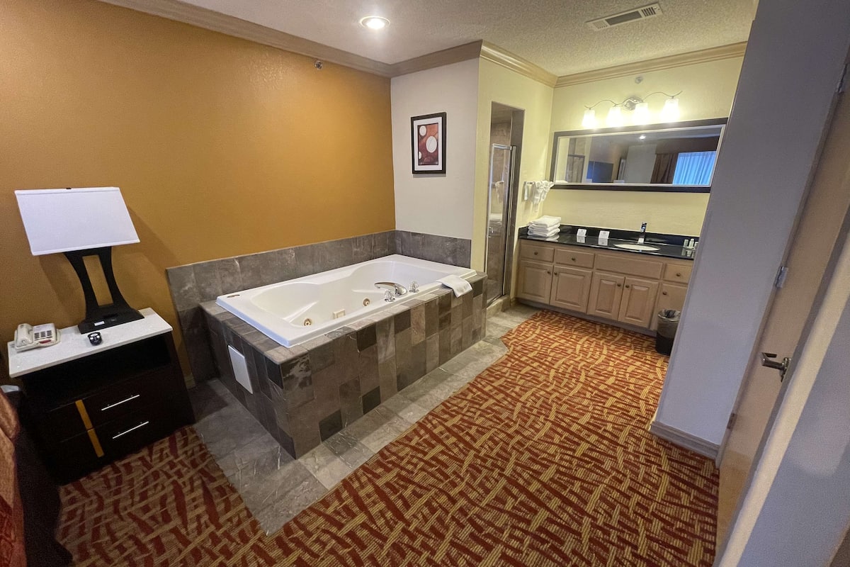 pillow-top beds, desk, laptop workspace, blackout curtains