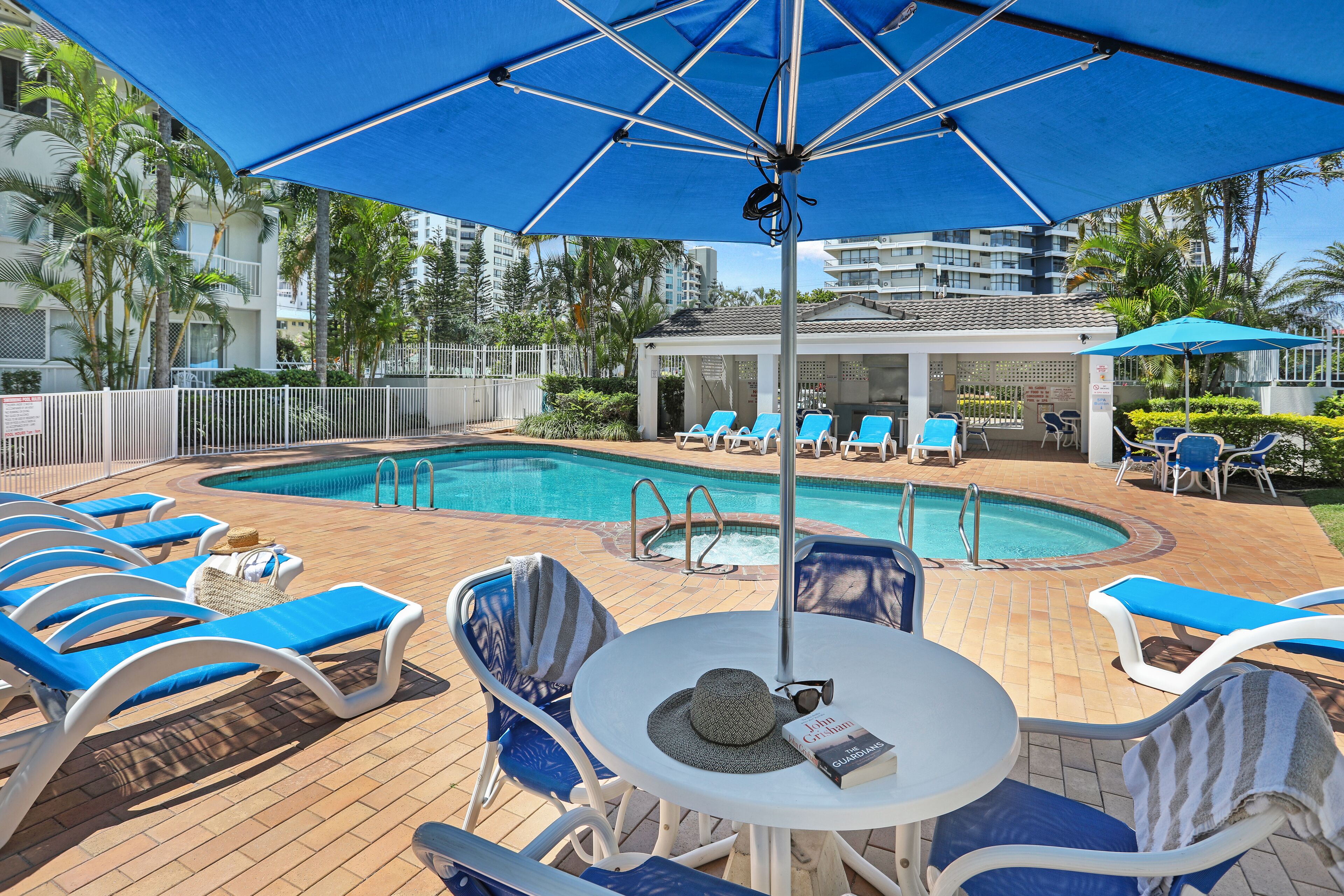 Outdoor pool, a heated pool, open 7 AM to 9 PM, pool umbrellas
