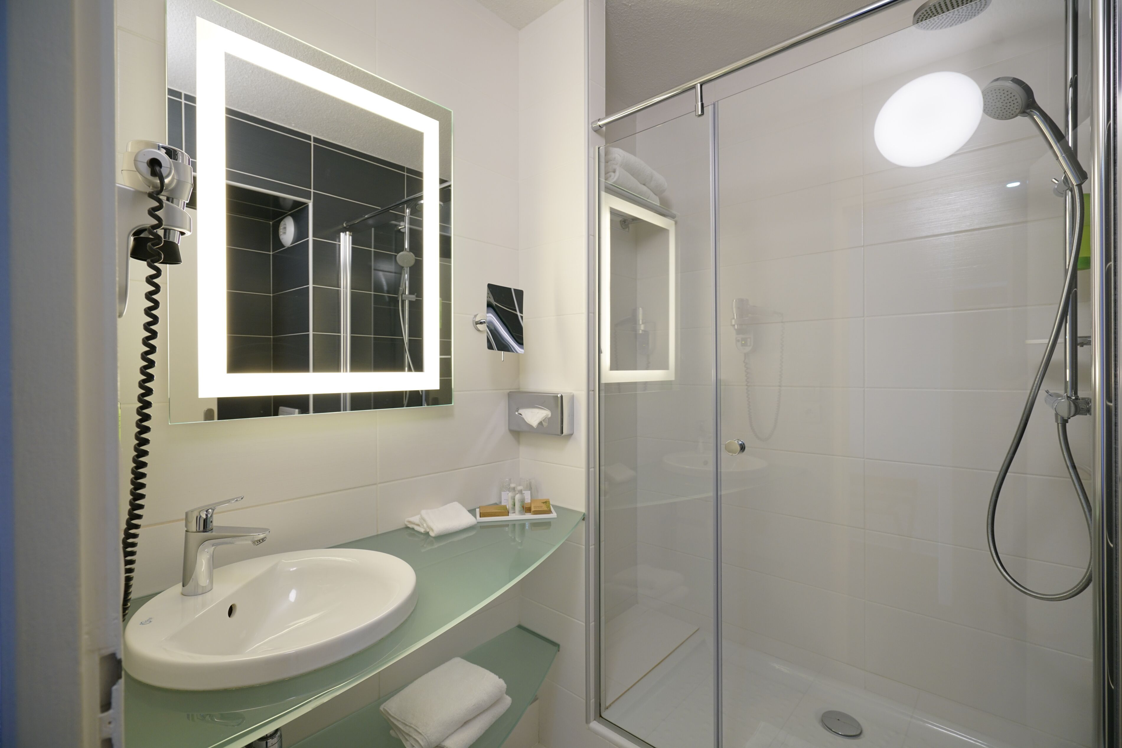 free toiletries, hair dryer, towels, shampoo