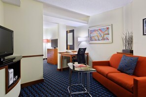 Suite, 1 King Bed with Sofa bed | Living area | 32-inch Smart TV with cable channels, TV, Netflix