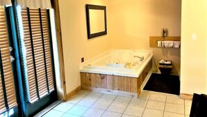 A bathroom with a bathtub, a shower, and a sink. - Elkhorn Mountain Inn (Clancy)