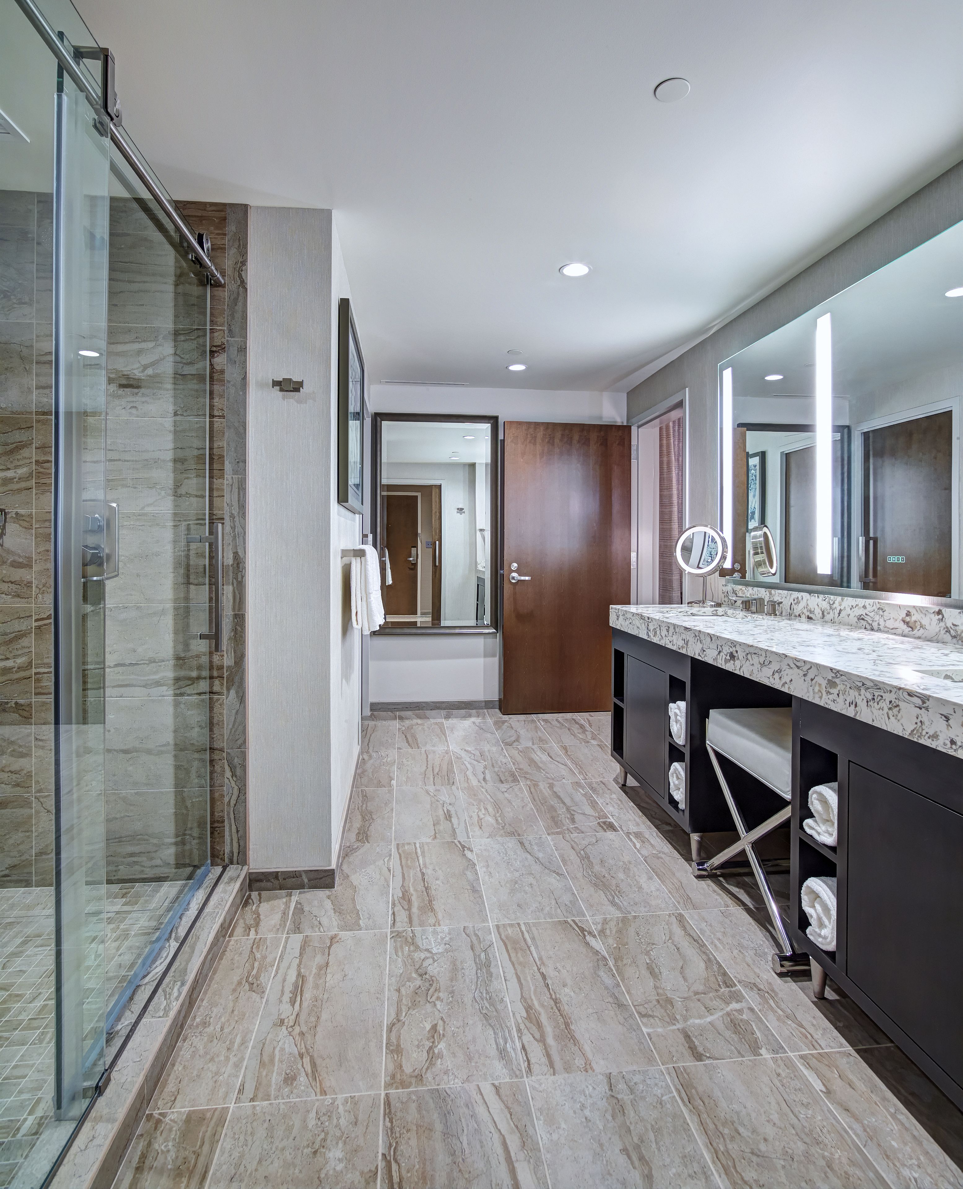 promenade tower suite | bathroom | eco-friendly toiletries, hair dryer, towels