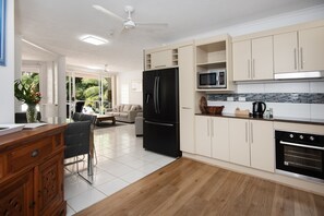 One-Bedroom King Apartment - Pool/Garden View | Private kitchen | Full-sized fridge, microwave, stovetop, coffee/tea maker