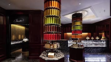 Experience the elegant lobby with polished flooring and rich paneling, featuring a unique display of tiered objects.