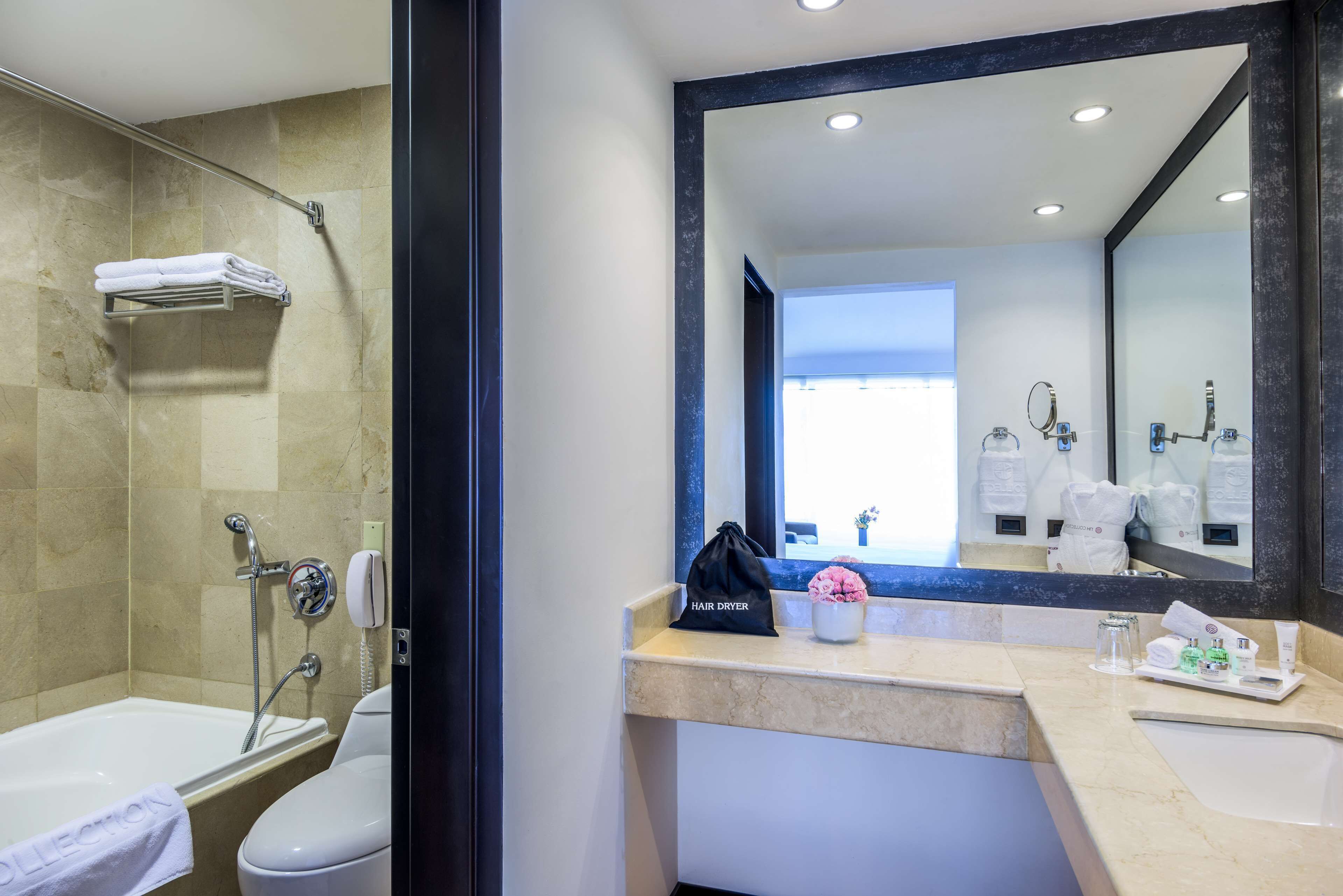 eco-friendly toiletries, hair dryer, towels