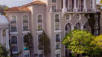 Experience the resort's elegant architecture with arched windows and balconies, offering stunning views.