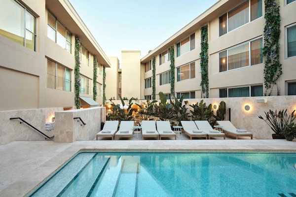 Outdoor pool, open 7:00 AM to 9:00 PM, pool umbrellas, pool loungers