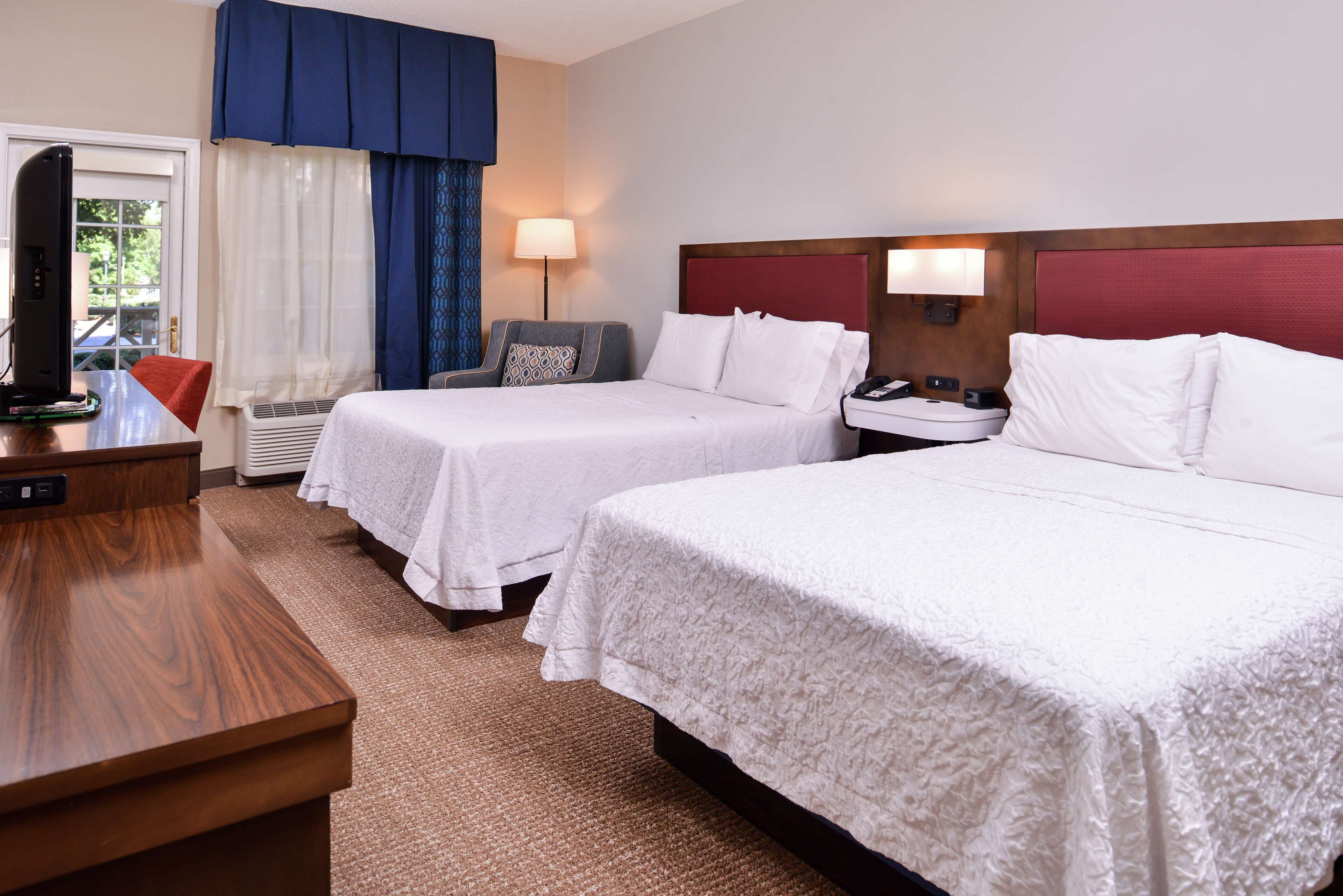 room, 2 queen beds, balcony | in-room safe, desk, iron/ironing board, cots/infant beds